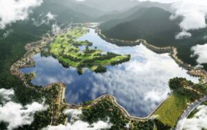An aerial view of Thanh Lanh Valley Golf Resort featuring a lush green golf course surrounded by a large reflective lake, rolling forested hills and scattered clouds.